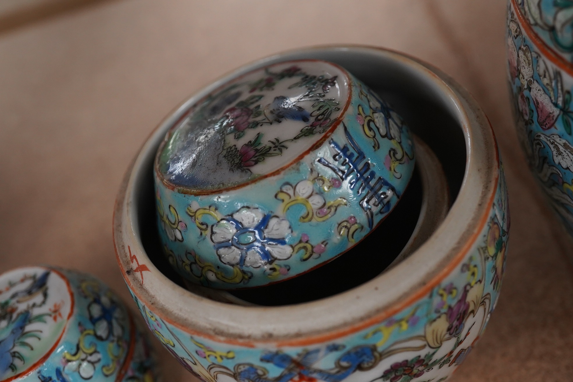 A complete Chinese porcelain nest of five enamelled porcelain barrel shaped boxes, c.1900, largest 12cm high. Condition - fair, some minor chipping